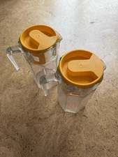 Two (2) Paşabahçe City Glass Jugs with Plastic Yellow Lids
