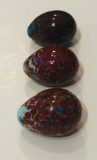 Rare set of three opaque egg shaped marbles