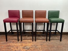 Set of 4 faux-leather bar stools in red, green and tan