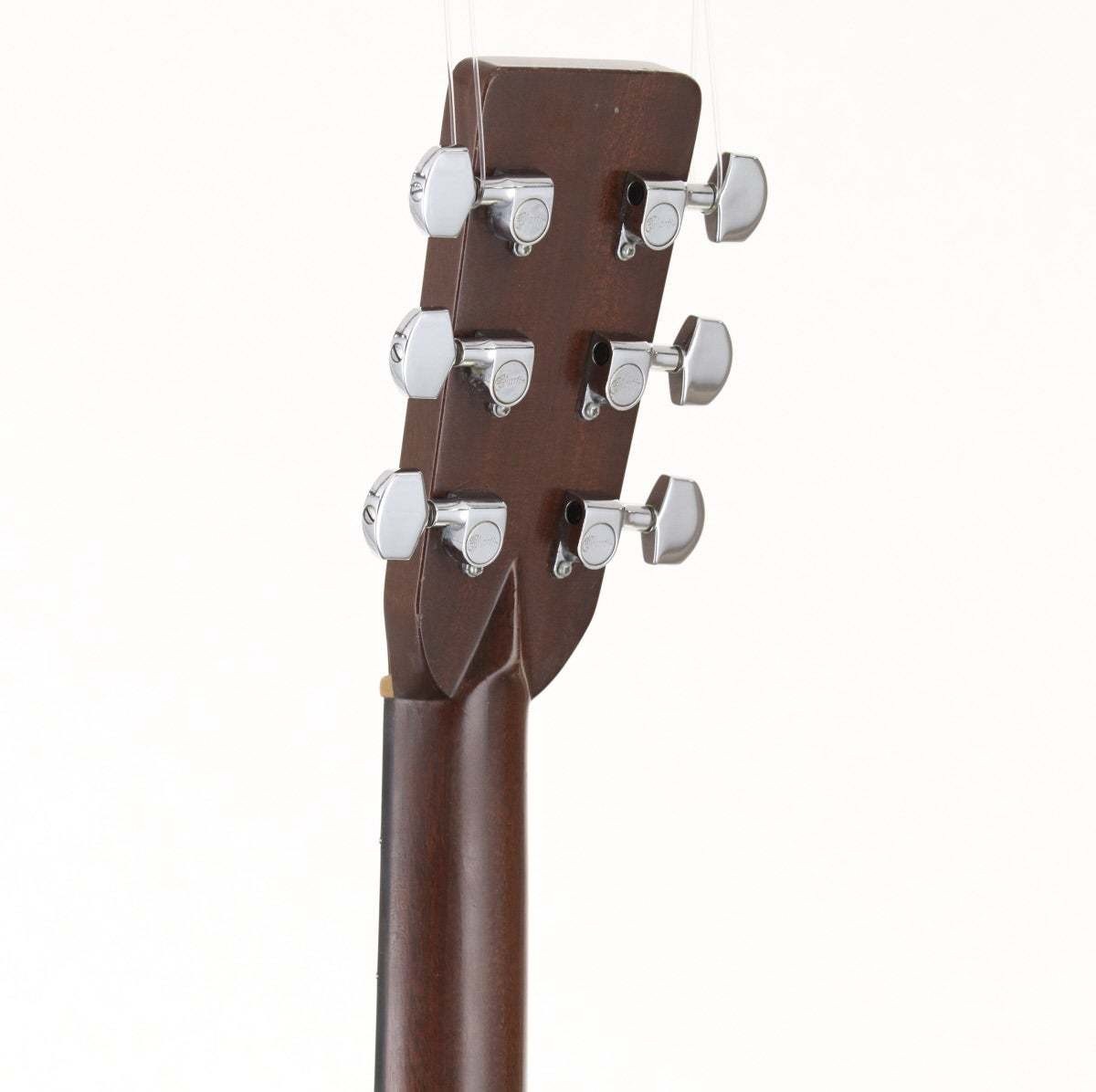 Martin D-28 acoustic guitar with light wood body, silver hardware, and six-string neck twist, shown from the back on a white background.