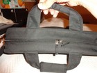 black synthetic computer bag, black, handles and shoulder strap. zipper closure — photo 5