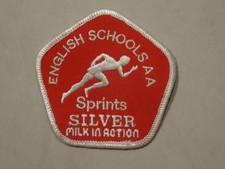 English Schools AA Sprints Silver Milk in Action Cloth Badge {Athletics}