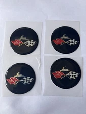 1 SET OF 4  DAYTON EMBLEMS BLACK SUPER SPORT IMPALA WIRE WHEELS  2 1/4 OR 57 MM