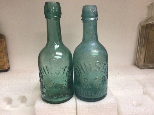 Two Vintage 1800s  teal blue Green Johnston And Co. Squat Soda Bottles. One mint