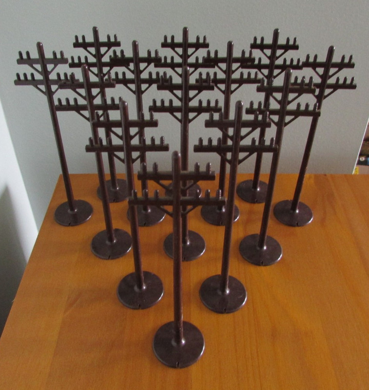 Marx, O Gauge, Telephone Poles and a Crossing Gate.  All are in excellent shape.