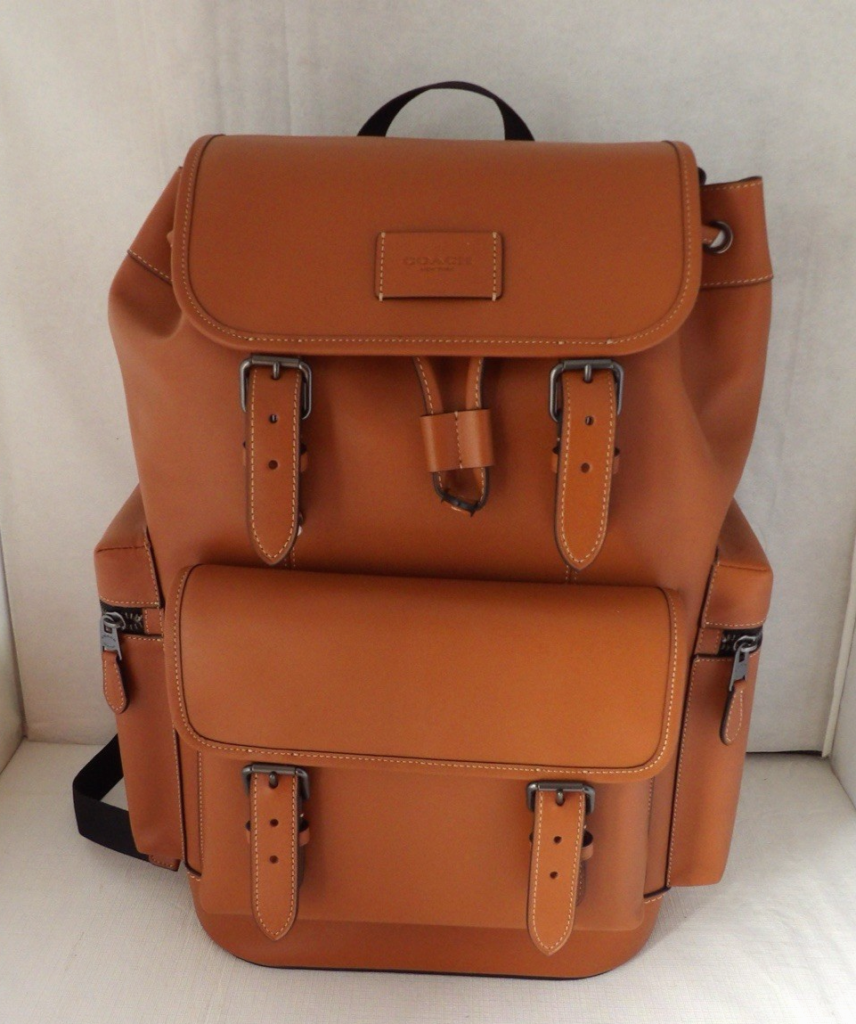 authentic coach backpack Turnlock ShopCGX Printed coated canvas and smooth calf leather Inside zip cell phone and multifunction pockets Inside tech sleeve with secure tab Flap and drawstring closures fabric lining Top handle with 3 drop Outside flap pockets Adjustable shoulder straps 10 1/4 (L) x 16 1/2 (H) x 5 (W) Style No Coach | Bags | Authentic