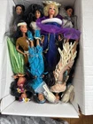 This is a box containing a collection of vintage Mattel Barbie dolls 12 dolls