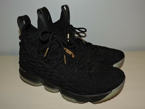 lebron james gold and black shoes