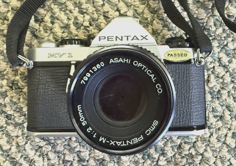 Pentax MV 1 35mm SLR Camera, with 50mm f/2 Pentax-M Lens, Strap, untested