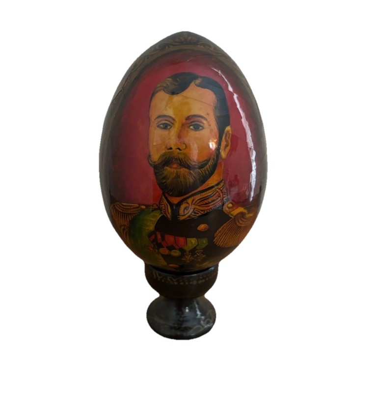 Vintage Russian painted wooden Easter egg with an image of St. Nicholas II