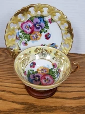 Vintage Royal Sealy China Pansies  flower Footed Teacup & Saucer
