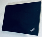 Black Lenovo ThinkPad P14S Gen 2 Touch with Ryzen 7 Pro 5850U, 32GB RAM, and red Lenovo logo on lid.
