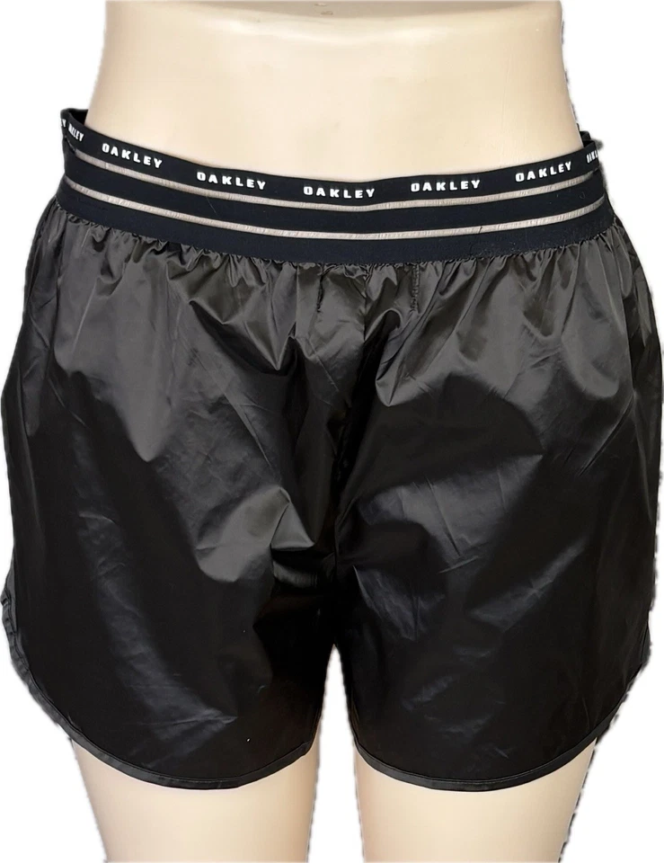 Pantalones cortos de lujo Oakley L con logotipo de ceniza oscura cintura de malla bolsillos laterales de nailon Foto 2 de 4