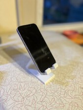 Universal phone stand, available in white or black.