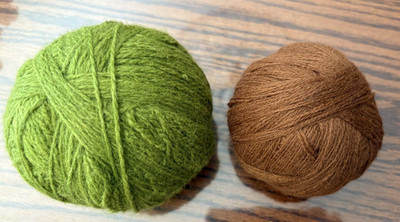 2 wool yarn balls brown and green, about 2 oz in each. used-left from a project