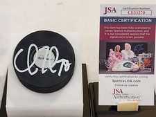 CHARLIE LINDGREN signed CAPITALS puck JSA COA