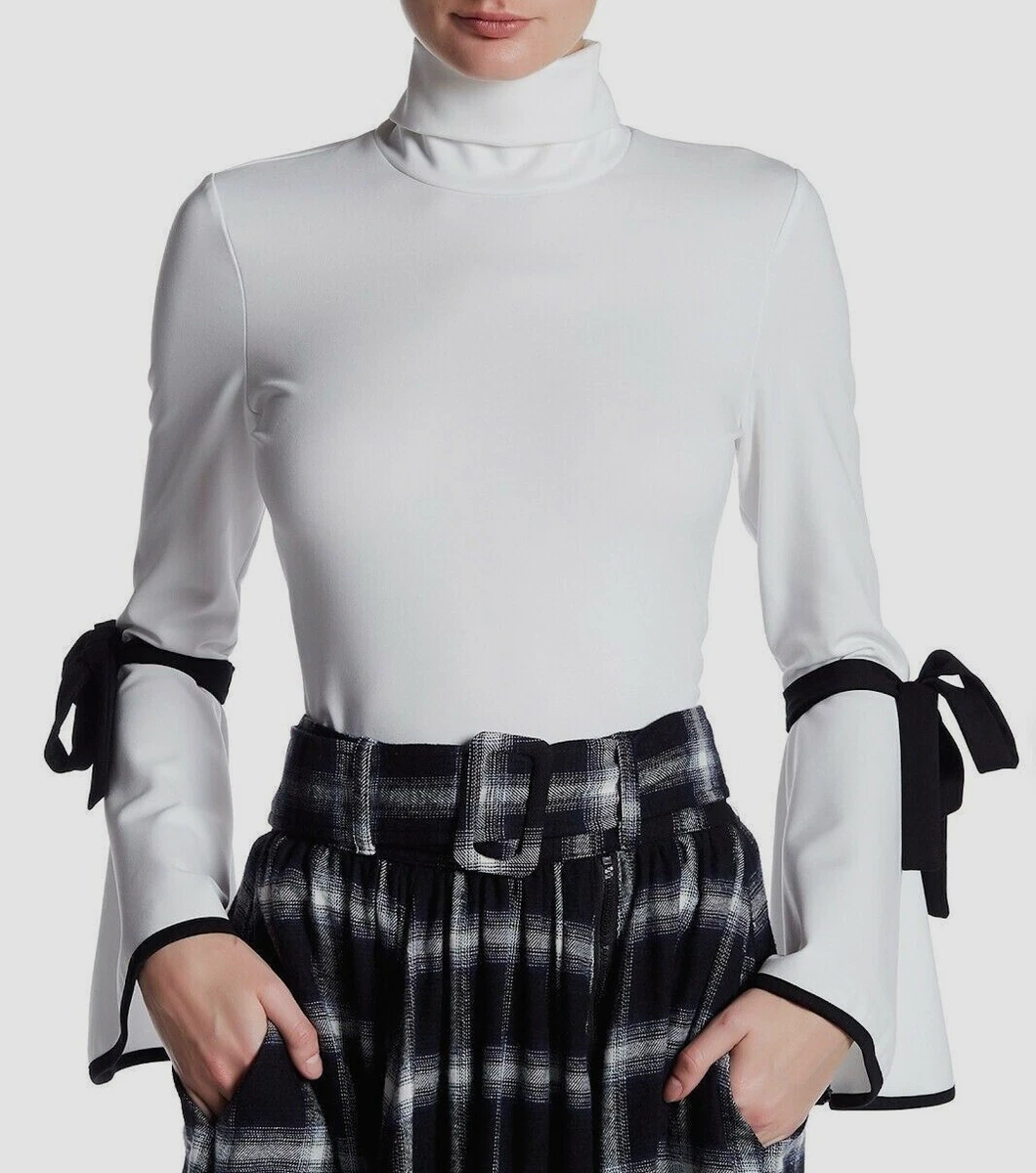 White turtleneck top with bell sleeves