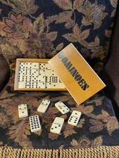“Double Nine” Dominoes Set with wooden storage box, contains 54 out of 55 tiles.