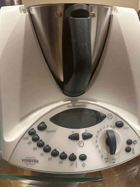 Thermomix TM3 220V is a kitchen appliance that can blend, heat, and cook food.