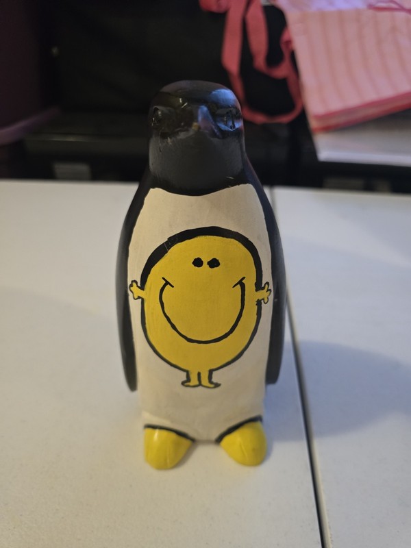 Wooden Penguin Figurine with Yellow Smiley Face Design, Hand-Painted