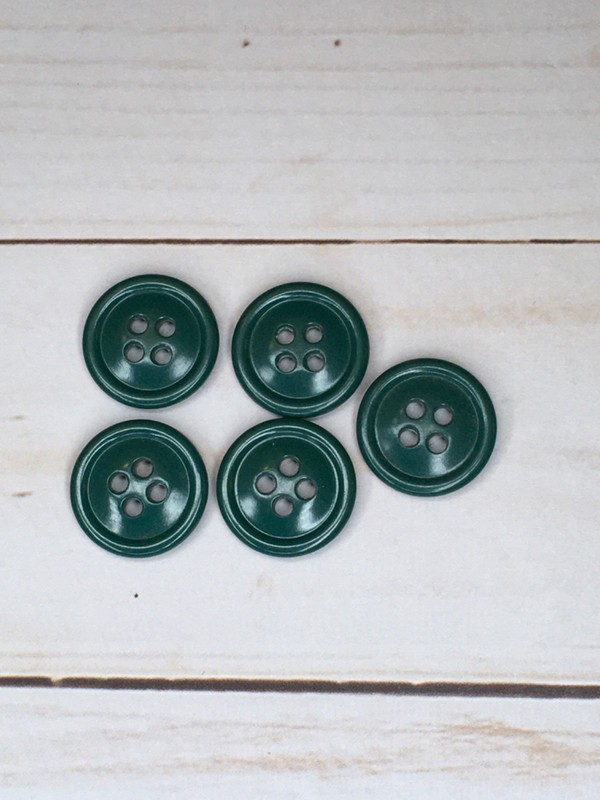 Green 4 hole raised edge button with a slight curved back- 3/4”
