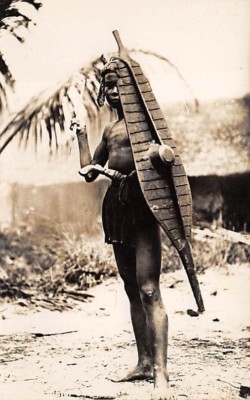 MALAYSIA, NATIVE MAN WITH WEAPONS & SHIELD POSED IMAGE REAL PHOTO PC c 1910-20's