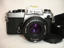 NIKON FE 35mm SLR Film Camera Body with 50mm f/ 1.8 lens , works good Chrome
