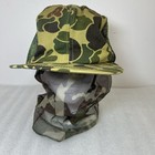 Green and brown camouflage Vtg hat with mesh front and dark green mosquito netting, size large USA made.