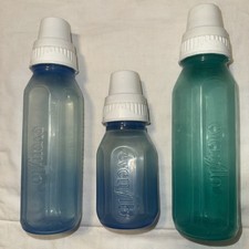 1876 lot of 3 Vintage Evenflo Plastic Baby Bottles Green Blue 8  4oz.