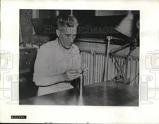 1942 Press Photo Ralph Francis a manufacturing dentist finds use for some of his