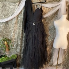 black, one-sleeve evening gown with a tulle skirt and a belt buckle.5XL