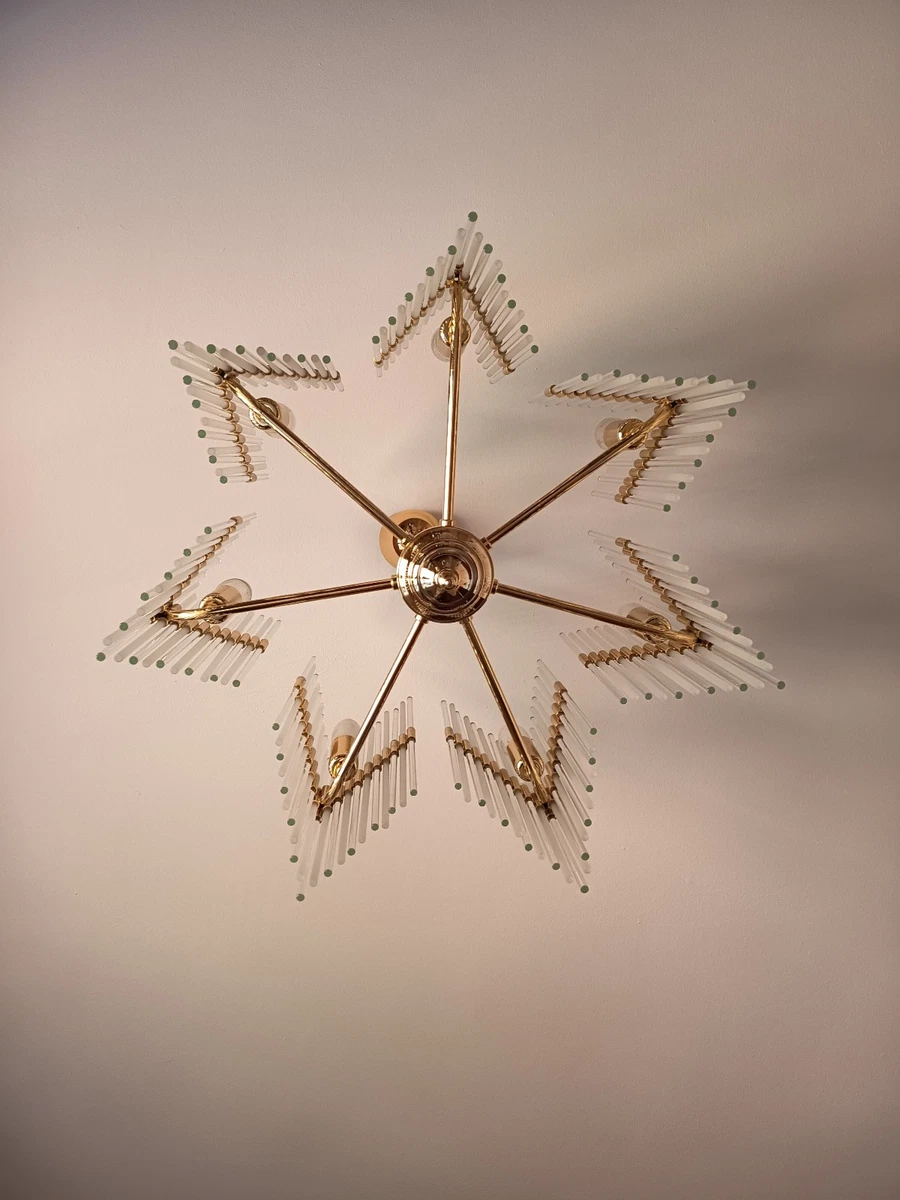 Elegante lámpara alemana de siete brazos, años ochenta. Forma de estrella.