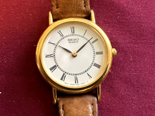 Vintage Seiko Watch Woman's Gold Tone, White Dial 25mm Round 1N00-0H80, Leather - Picture 1 of 4