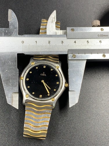 Reloj de cuarzo vintage Ebel clásico ondulado medio dorado negro 14800194 781903 para hombre 33 mm - Imagen 23 de 23