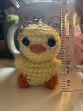 handmade crochet keychain or charm of a duckl...