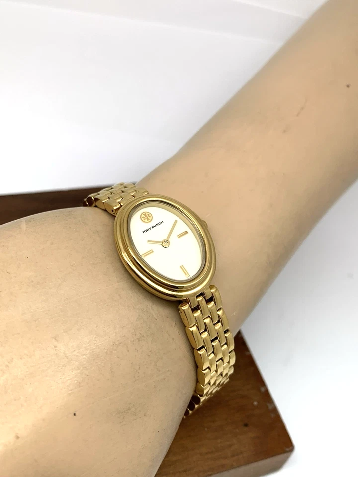 Reloj para mujer Tory Burch TBW6032 cuarzo ovalado esfera crema dorado acero inoxidable Foto 4 de 4