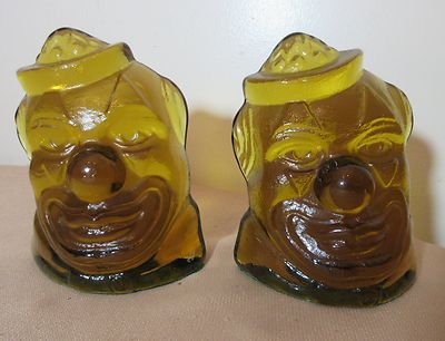 pair large solid heavy amber orange glass figural clown face bookends book ends