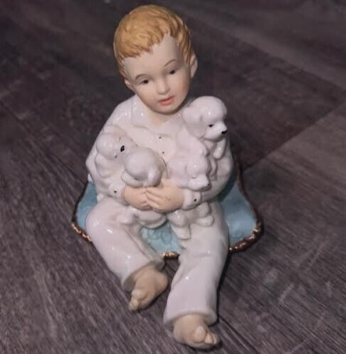 H.M. L. 2003 boy holding white puppies gold edge porcelain figurine boy