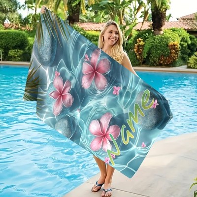A Personalized Custom Beach Towel with a Large Floral And Stone Pattern, Featu