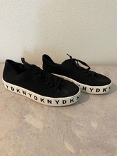 DKNY sneaker women, white Black with brand logo on sole. Size US7