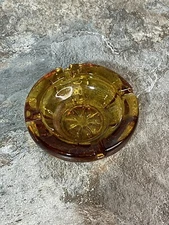 AMBER GLASS ROUND CIGARETTE STAR PATTERN ASHTRAY