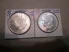 TWO (2) MORGAN SILVER DOLLARS, (1) 1885-P AND (1) 1889-P NEAR UNC CONDITION