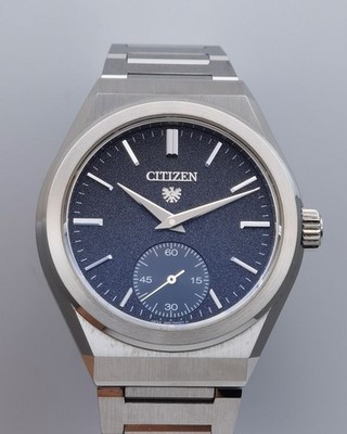 The CITIZEN NC0200-90E Small Second Cal.0200 Sand Pattern Black Dial SS Automati