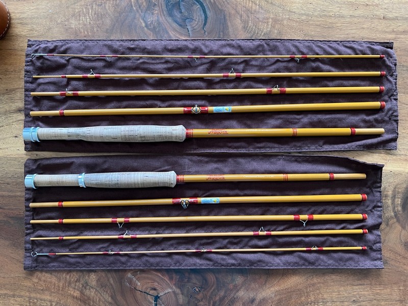 A pair of Tiemco Fenwick travel/backback Fiberglass Fly Rod s in Leather Tube