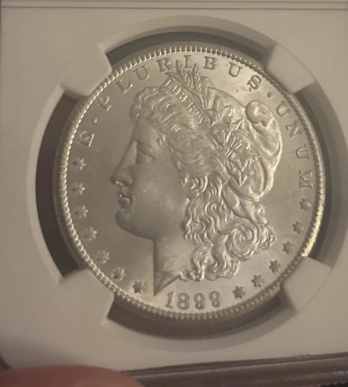 1899 O Morgan Dollar Silver Dollar, NGC MS65, perfectly smooth cheek, beautiful  - Image 4 of 4