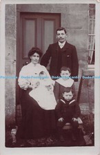 R692302 Family pPhoto. Woman and a Man with Three Children at Home
