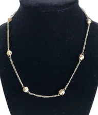 Avon gold tone with gold Nuggets approximately 8"long Ring Clasp Good Condi