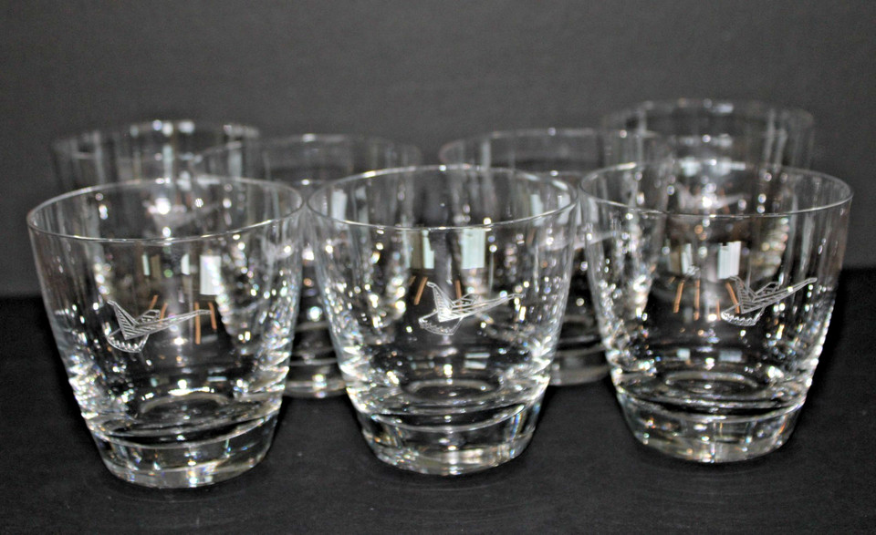 A set of 7 etched Ford Thunderbird lowball glasses — MCM automotive nostalgia meets functional barware in a rare complete set.