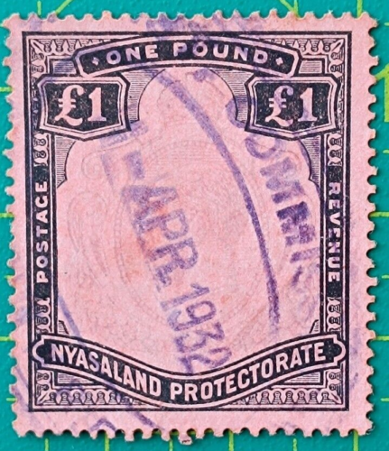 Protectorado Nyasland 1918,1 libra negro y violeta, rojo, error de impresión George V., usado - Imagen 1 de 4