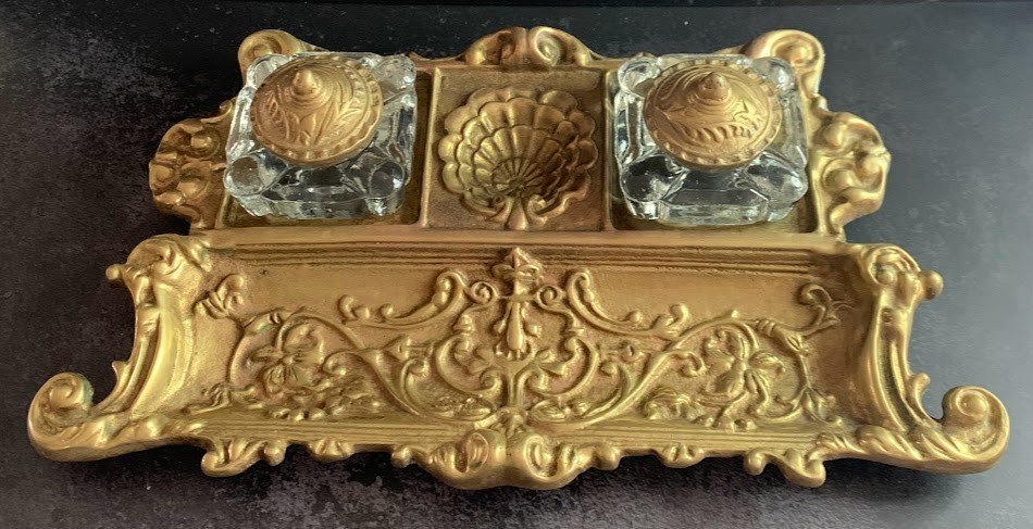A genuine 1930s Victorian brass double glass inkwell — a functional antique artifact that makes any desk look like a literary scholar's study.
